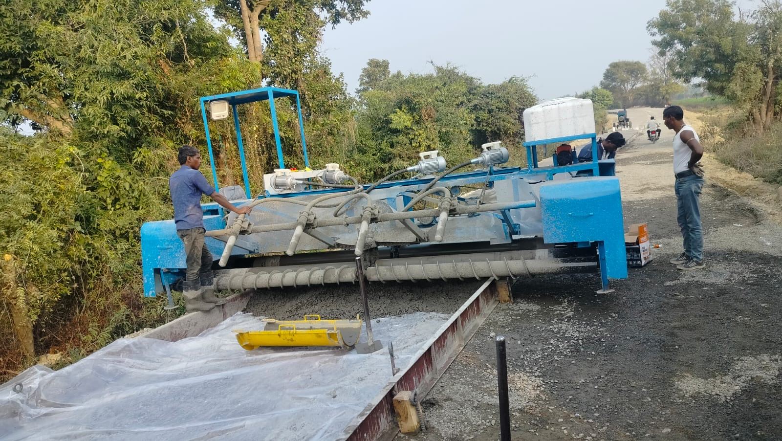 RG Steel Crafts fixed form concrete paver paving a road on site