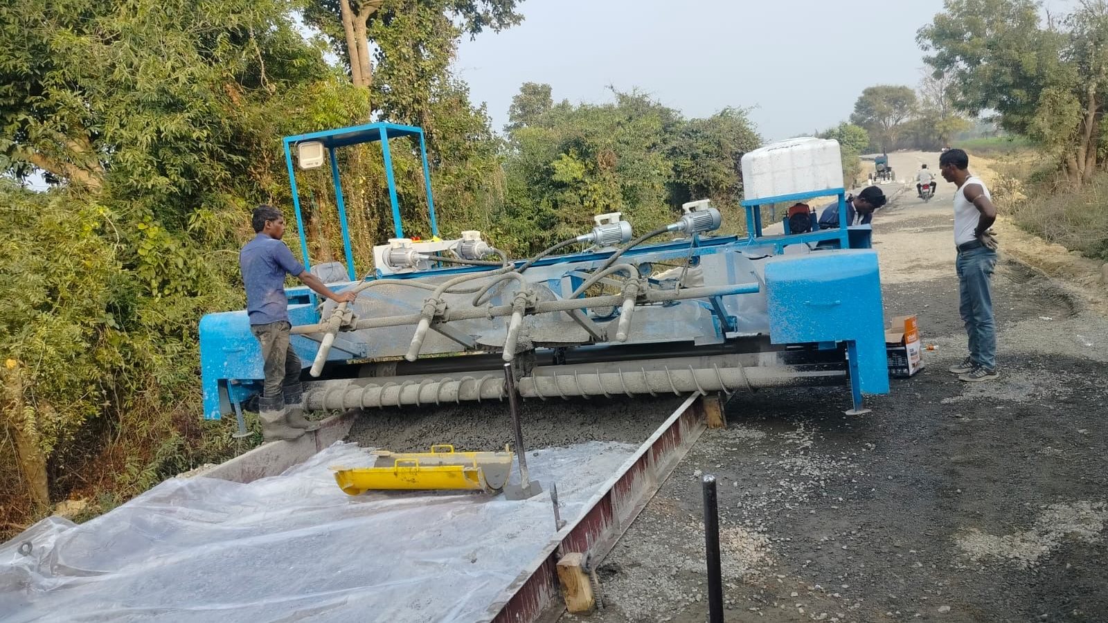 RG Steel Crafts fixed form concrete paver paving a road on site